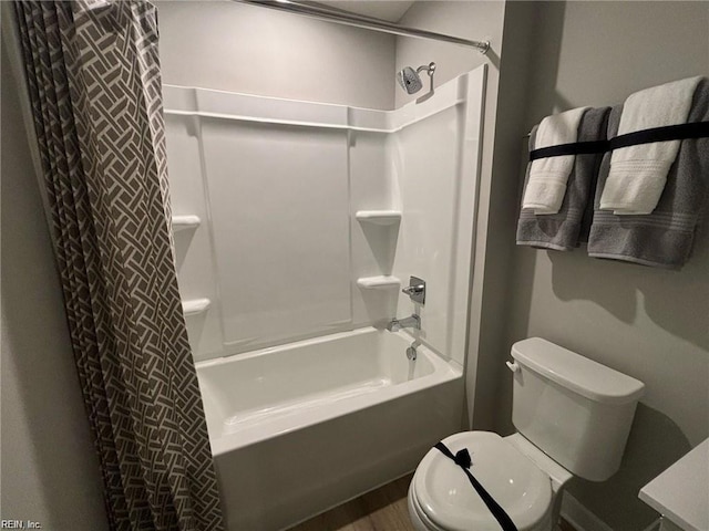 bathroom featuring toilet and shower / bath combo with shower curtain