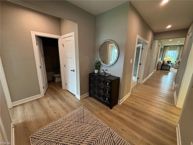 hallway with light wood-type flooring