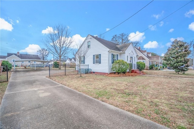 view of side of home with a yard and a carport