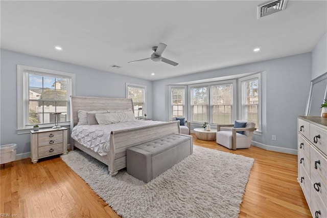 bedroom featuring light wood-type flooring and ceiling fan