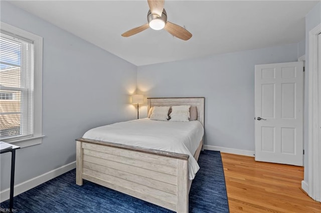 bedroom featuring dark wood-type flooring and ceiling fan