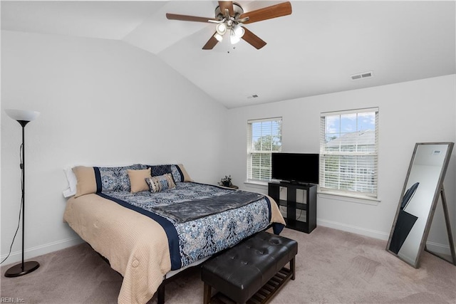 bedroom with vaulted ceiling, ceiling fan, and light colored carpet