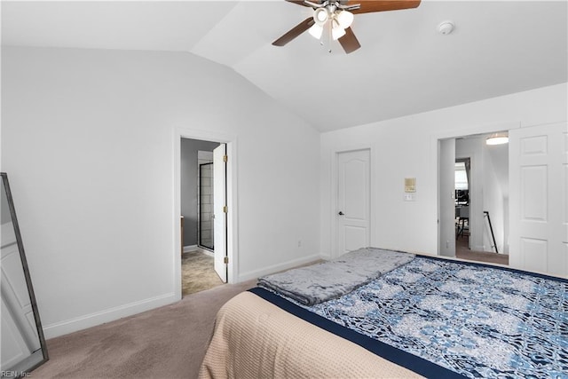 carpeted bedroom with ceiling fan and vaulted ceiling