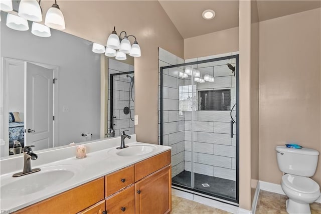 bathroom with tile patterned floors, toilet, an enclosed shower, an inviting chandelier, and vanity