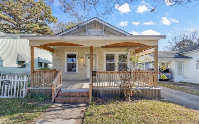 bungalow-style house featuring covered porch