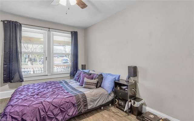 bedroom with hardwood / wood-style flooring and ceiling fan