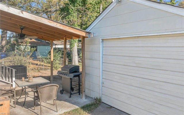 view of patio / terrace featuring a grill and ceiling fan