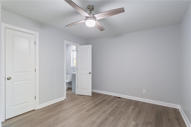 unfurnished bedroom with ceiling fan and light hardwood / wood-style floors