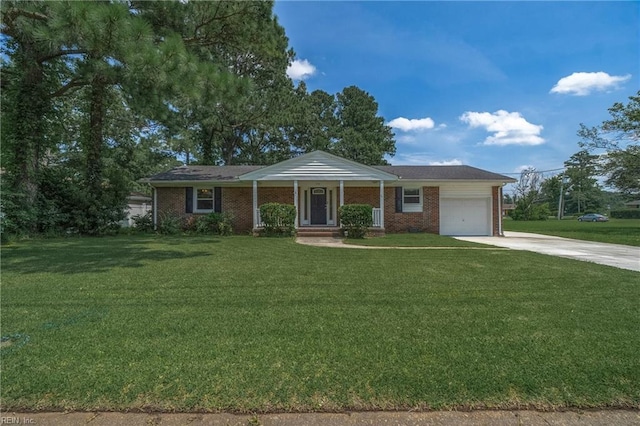 view of front of home with a garage, a front yard, and a porch