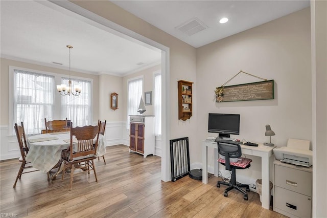 home office featuring crown molding, a chandelier, and light hardwood / wood-style flooring