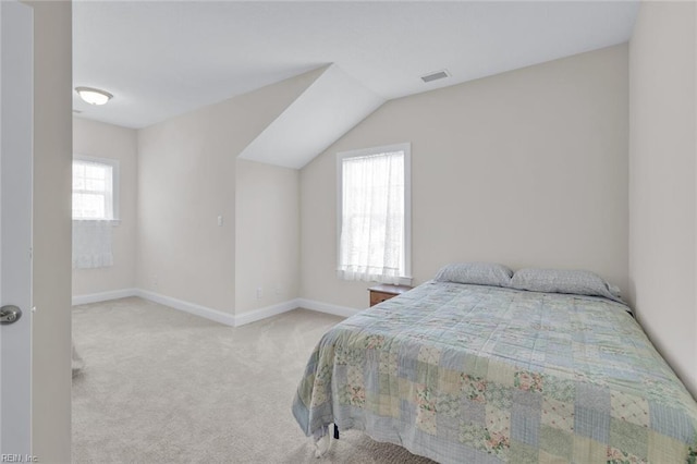 bedroom featuring light colored carpet