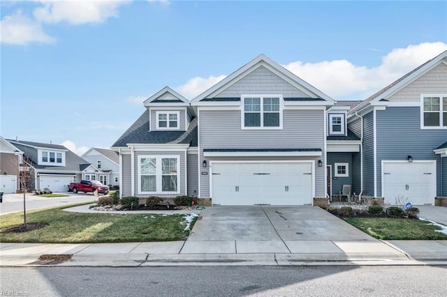 view of front of house featuring a garage and a front lawn