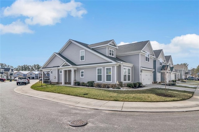 view of front of property with a garage and a front yard