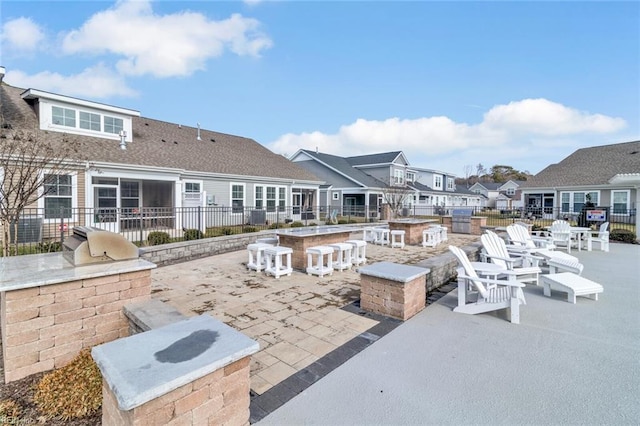 view of patio / terrace with an outdoor kitchen and an outdoor bar