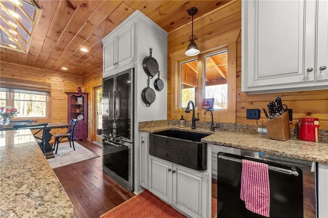 kitchen with dishwasher, white cabinets, and wood ceiling