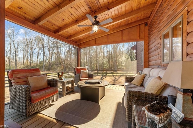 exterior space with an outdoor living space with a fire pit and ceiling fan