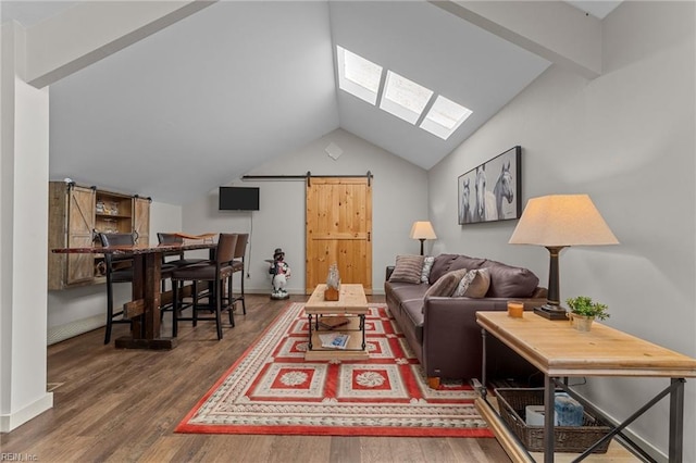 living room with dark hardwood / wood-style floors, a barn door, and lofted ceiling with skylight