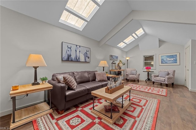 living room featuring wood-type flooring, high vaulted ceiling, and a skylight