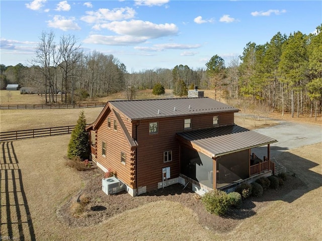 birds eye view of property featuring a rural view