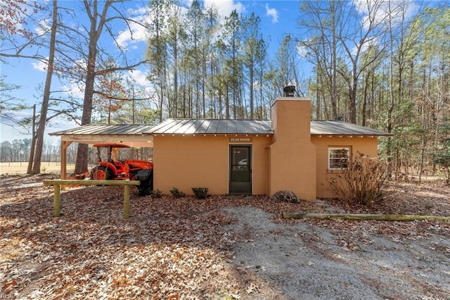 exterior space featuring a carport