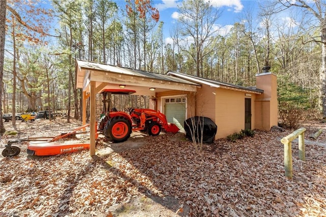 view of outbuilding with a carport