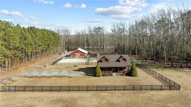 rear view of property with a rural view