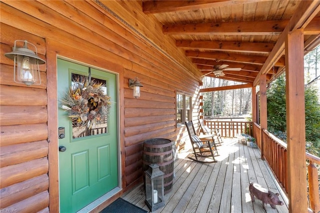 wooden deck featuring ceiling fan and covered porch