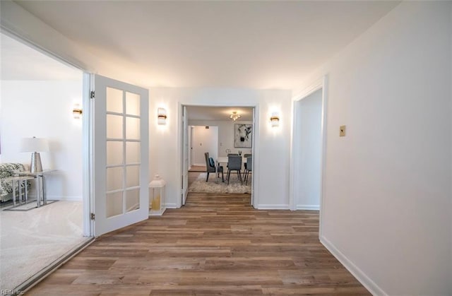 corridor featuring hardwood / wood-style floors