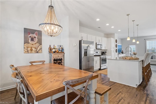 dining space featuring dark hardwood / wood-style floors