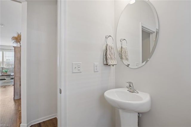 bathroom with sink and hardwood / wood-style floors