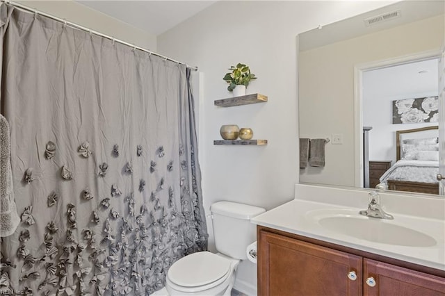 bathroom with vanity, toilet, and a shower with shower curtain