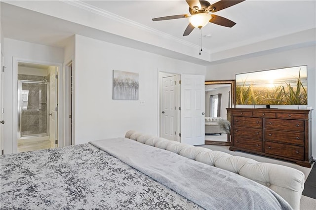 bedroom featuring crown molding, ceiling fan, and ensuite bath