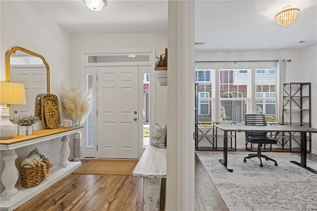 foyer entrance featuring hardwood / wood-style floors