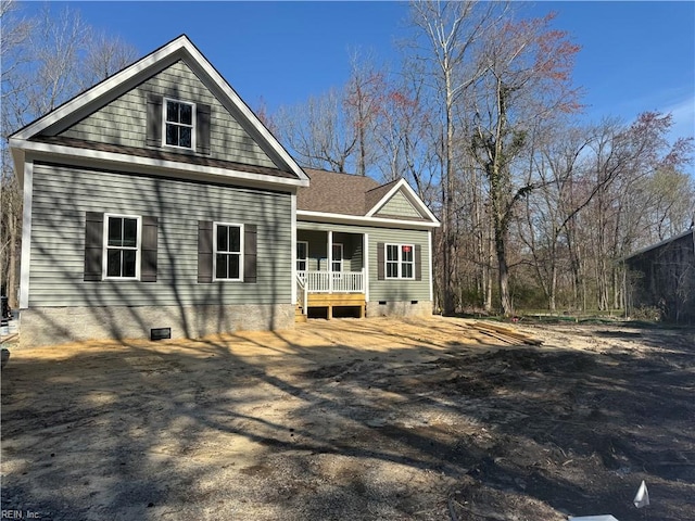 rear view of house with a porch