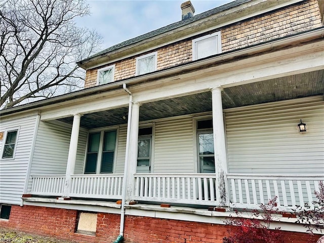 view of side of home featuring a porch