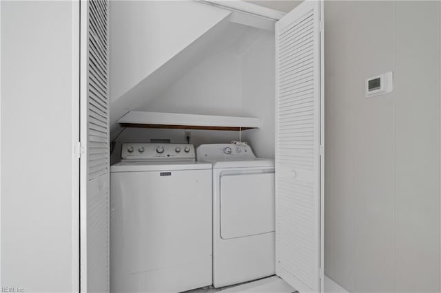 laundry room featuring washing machine and clothes dryer