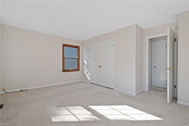 unfurnished bedroom featuring light colored carpet