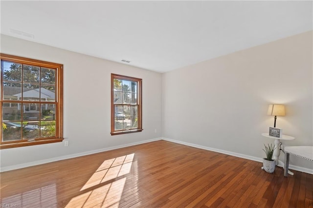 spare room featuring hardwood / wood-style flooring