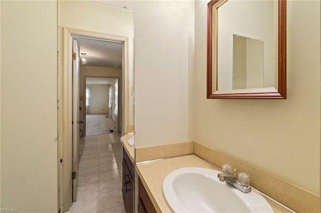 bathroom with tile patterned floors and vanity