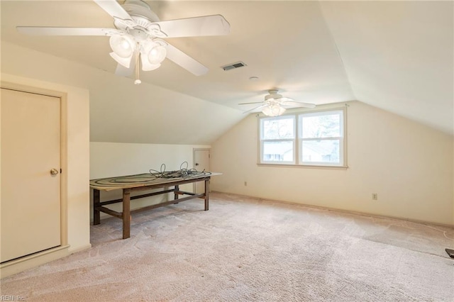 bonus room featuring lofted ceiling, light colored carpet, and ceiling fan