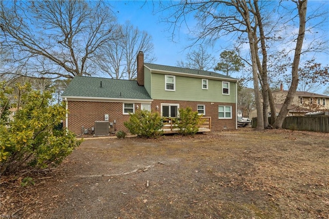 back of house featuring a wooden deck and central AC