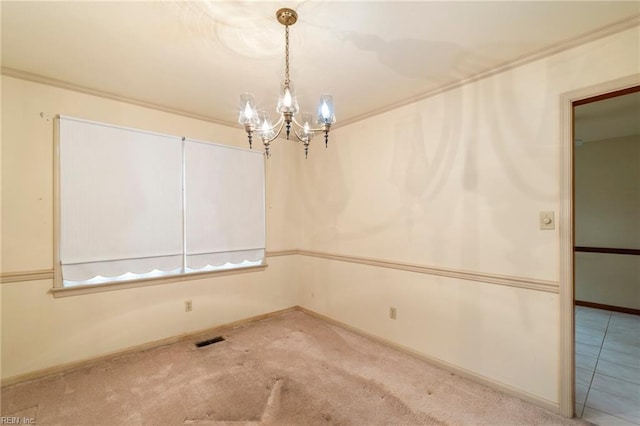 carpeted empty room with an inviting chandelier