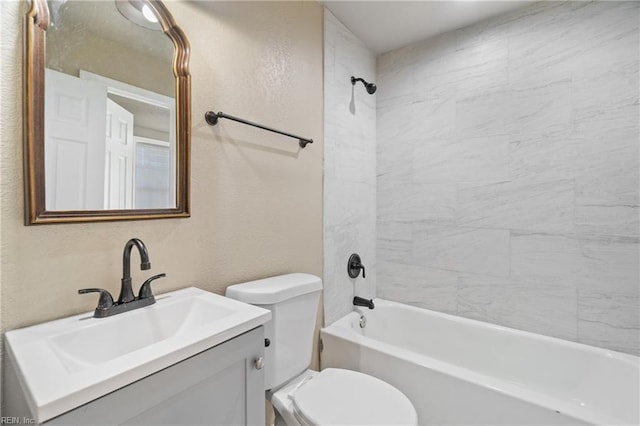 full bathroom featuring vanity, toilet, and tiled shower / bath combo