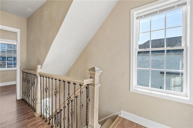 stairway featuring a mountain view and hardwood / wood-style floors