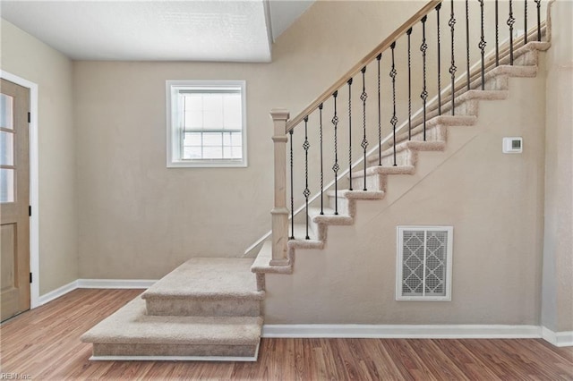 entryway with hardwood / wood-style flooring