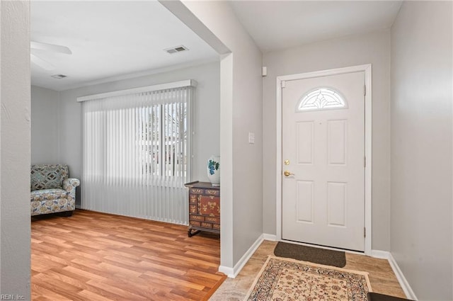 entrance foyer featuring plenty of natural light and light wood-type flooring