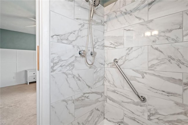 bathroom featuring tiled shower