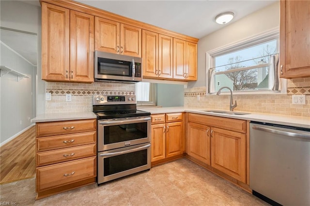 kitchen featuring sink, backsplash, and stainless steel appliances