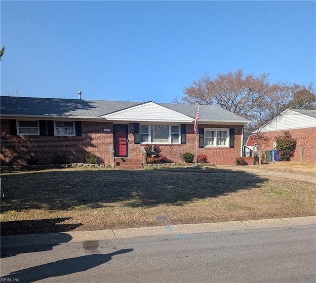 single story home featuring a front yard