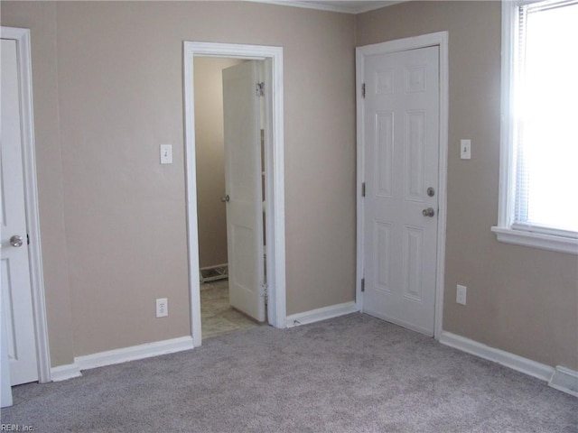 interior space featuring light colored carpet